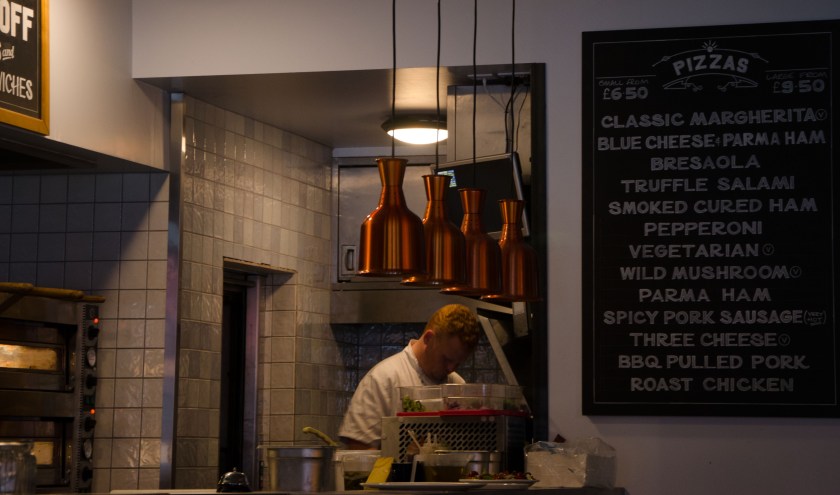 Wood fired pizzas being made
